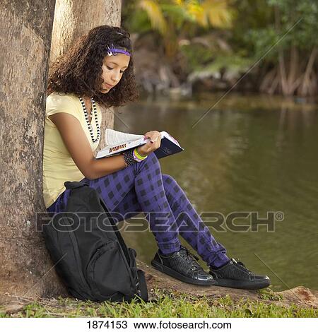 fort lauderdale, florida, united states of america; a girl reading a book under a tree View Large Photo Image Stock Image - fort lauderdale, florida, united states of america; a girl reading a book under a tree. Fotosearch