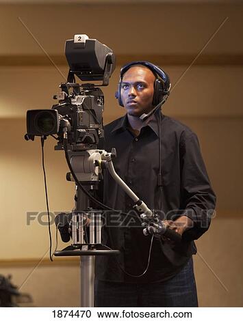 fort lauderdale, florida, united states of america; a man operating a tv camera View Large Photo Image Stock Image - fort lauderdale, florida, united states of america; a man operating a tv camera. Fotosearch