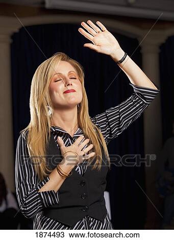 fort lauderdale, florida, united states of america; a woman with her hand raised in worship View Large Photo Image Stock Image - fort lauderdale, florida, united states of america; a woman with her hand raised in worship. Fotosearch
