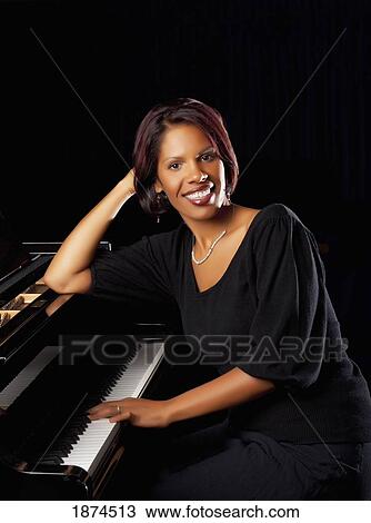 fort lauderdale, florida, united states of america; a woman sitting at the piano View Large Photo Image Stock Image - fort lauderdale, florida, united states of america; a woman sitting at the piano. Fotosearch