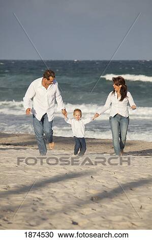 fort lauderdale, florida, united states of america; a family walking together on the beach View Large Photo Image Stock Image - fort lauderdale, florida, united states of america; a family walking together on the beach. Fotosearch