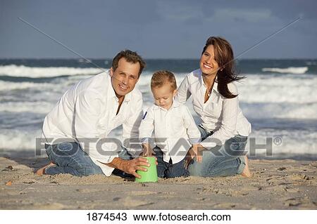 fort lauderdale, florida, united states of america; a family playing in the sand on the beach View Large Photo Image Stock Image - fort lauderdale, florida, united states of america; a family playing in the sand on the beach. Fotosearch