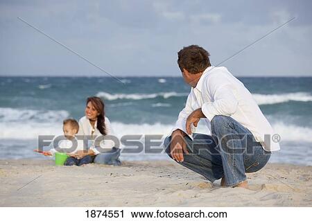 fort lauderdale, florida, united states of america; a man on the beach with his family View Large Photo Image Stock Image - fort lauderdale, florida, united states of america; a man on the beach with his family. Fotosearch