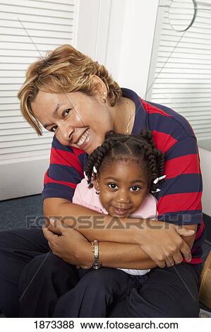 fort lauderdale, florida, united states of america; a woman hugging a young girl View Large Photo Image Stock Photo - fort lauderdale, florida, united states of america; a woman hugging a young girl. Fotosearch