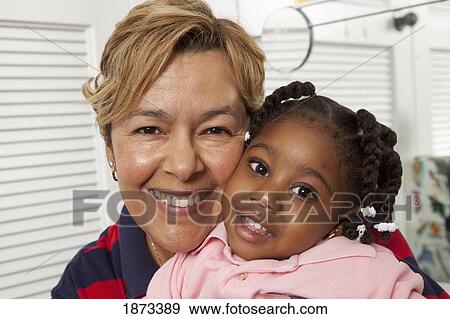 fort lauderdale, florida, united states of america; a teacher hugging a young girl View Large Photo Image Stock Photo - fort lauderdale, florida, united states of america; a teacher hugging a young girl. Fotosearch