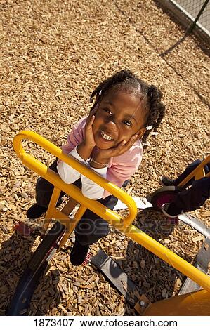 fort lauderdale, florida, united states of america; a young girl playing at a playground View Large Photo Image Stock Photo - fort lauderdale, florida, united states of america; a young girl playing at a playground. Fotosearch