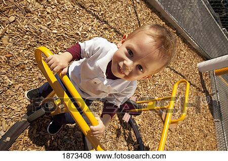 fort lauderdale, florida, united states of america; a young boy playing at a playground View Large Photo Image Stock Photo - fort lauderdale, florida, united states of america; a young boy playing at a playground. Fotosearch