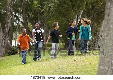 fort lauderdale, florida, united states of america; a group of preteens walking and talking together View Large Photo Image Stock Photo - fort lauderdale, florida, united states of america; a group of preteens walking and talking together. Fotosearch