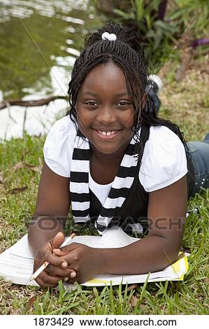 fort lauderdale, florida, united states of america; a girl doing school work in the park View Large Photo Image Stock Photo - fort lauderdale, florida, united states of america; a girl doing school work in the park. Fotosearch