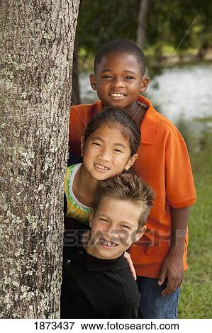 fort lauderdale, florida, united states of america; three preteens beside a tree in the park View Large Photo Image Stock Photo - fort lauderdale, florida, united states of america; three preteens beside a tree in the park. Fotosearch
