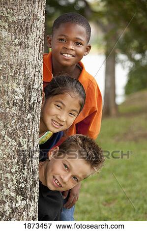 fort lauderdale, florida, united states of america; three preteens hiding behind a tree View Large Photo Image Stock Photo - fort lauderdale, florida, united states of america; three preteens hiding behind a tree. Fotosearch