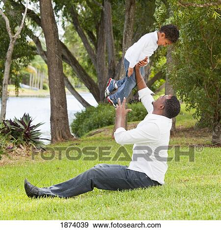fort lauderdale, florida, united states of america; a father playing with his son View Large Photo Image Stock Photo - fort lauderdale, florida, united states of america; a father playing with his son. Fotosearch