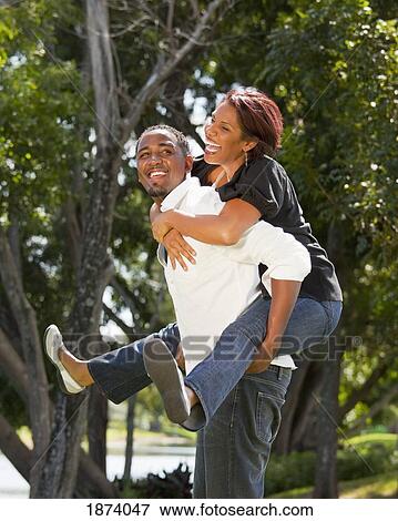 fort lauderdale, florida, united states of america; a couple having fun together in a park View Large Photo Image Stock Photo - fort lauderdale, florida, united states of america; a couple having fun together in a park. Fotosearch