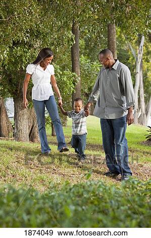 fort lauderdale, florida, united states of america; a mother and father walking with their young son View Large Photo Image Stock Photo - fort lauderdale, florida, united states of america; a mother and father walking with their young son. Fotosearch
