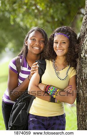 Stock Photo - fort lauderdale, florida, united states of america; two teenage girls in a park. Fotosearch