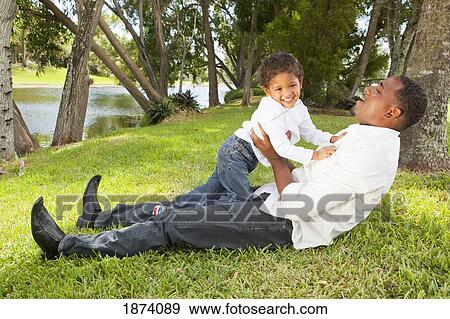 fort lauderdale, florida, united states of america; a father playing with his young son View Large Photo Image Stock Photo - fort lauderdale, florida, united states of america; a father playing with his young son. Fotosearch