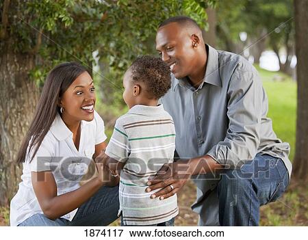 Stock Photo - fort lauderdale, florida, united states of america; a mother and father with their young son. Fotosearch