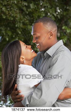 fort lauderdale, florida, united states of america; a couple holding each other close View Large Photo Image Stock Photo - fort lauderdale, florida, united states of america; a couple holding each other close. Fotosearch