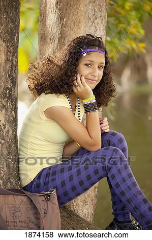 fort lauderdale, florida, united states of america; a girl sitting under a tree View Large Photo Image Stock Photo - fort lauderdale, florida, united states of america; a girl sitting under a tree. Fotosearch
