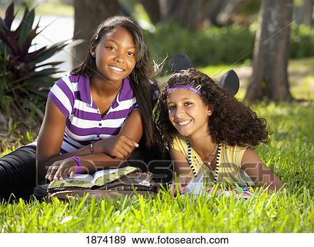 fort lauderdale, florida, united states of america; two teenage girls in the park with their school books View Large Photo Image Stock Photo - fort lauderdale, florida, united states of america; two teenage girls in the park with their school books. Fotosearch