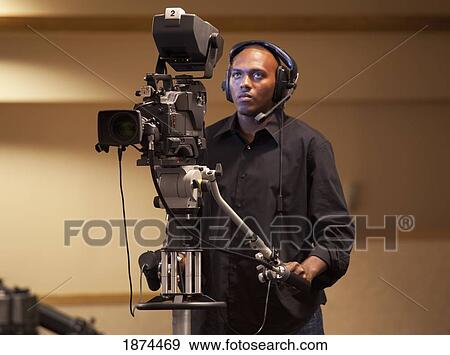 fort lauderdale, florida, united states of america; a man operating a tv camera View Large Photo Image Stock Photo - fort lauderdale, florida, united states of america; a man operating a tv camera. Fotosearch