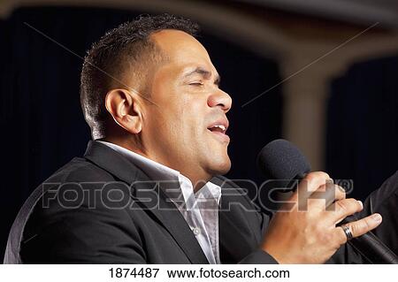 fort lauderdale, florida, united states of america; a man singing into a microphone and leading worship View Large Photo Image Stock Photo - fort lauderdale, florida, united states of america; a man singing into a microphone and leading worship. Fotosearch