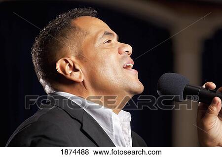 fort lauderdale, florida, united states of america; a man singing into a microphone and leading worship View Large Photo Image Stock Photo - fort lauderdale, florida, united states of america; a man singing into a microphone and leading worship. Fotosearch