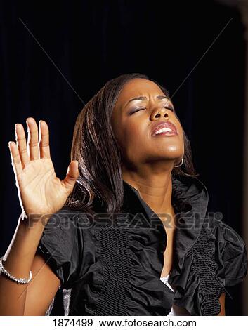 fort lauderdale, florida, united states of america; a woman singing in worship View Large Photo Image Stock Photo - fort lauderdale, florida, united states of america; a woman singing in worship. Fotosearch