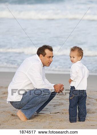 fort lauderdale, florida, united states of america; a father and son on the beach by the ocean View Large Photo Image Stock Photo - fort lauderdale, florida, united states of america; a father and son on the beach by the ocean. Fotosearch
