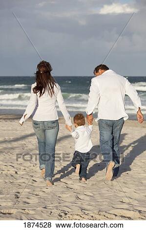 fort lauderdale, florida, united states of america; a family walking on the beach View Large Photo Image Stock Photo - fort lauderdale, florida, united states of america; a family walking on the beach. Fotosearch