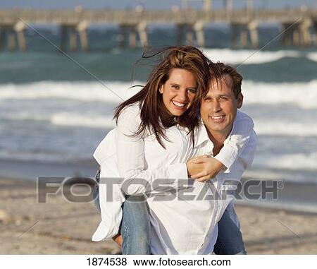 Stock Photo - fort lauderdale, florida, united states of america; a couple on the beach. Fotosearch