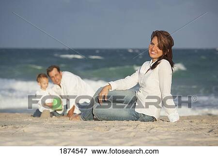 fort lauderdale, florida, united states of america; a woman on the beach with her family View Large Photo Image Stock Photo - fort lauderdale, florida, united states of america; a woman on the beach with her family. Fotosearch
