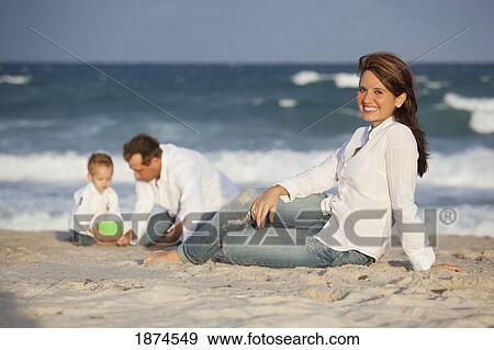 fort lauderdale, florida, united states of america; a woman on the beach with her family View Large Photo Image Stock Photo - fort lauderdale, florida, united states of america; a woman on the beach with her family. Fotosearch
