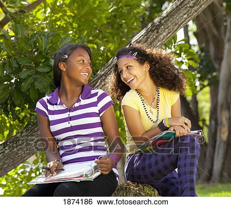 fort lauderdale, florida, united states of america; two teenage girls doing school work in the park View Large Photo Image Stock Photograph - fort lauderdale, florida, united states of america; two teenage girls doing school work in the park. Fotosearch