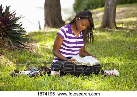 fort lauderdale, florida, united states of america; a teenage girl reading a bible in the park View Large Photo Image Stock Photograph - fort lauderdale, florida, united states of america; a teenage girl reading a bible in the park. Fotosearch