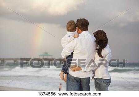 fort lauderdale, florida, united states of america; a family looking at a rainbow in the sky from the beach View Large Photo Image Stock Photograph - fort lauderdale, florida, united states of america; a family looking at a rainbow in the sky from the beach. Fotosearch