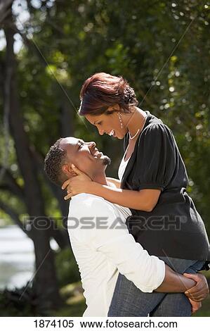 Stock Photography - fort lauderdale, florida, united states of america; a couple together in a park. Fotosearch
