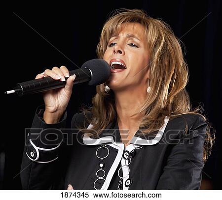 fort lauderdale, florida, united states of america; a woman singing in a microphone View Large Photo Image Stock Photography - fort lauderdale, florida, united states of america; a woman singing in a microphone. Fotosearch