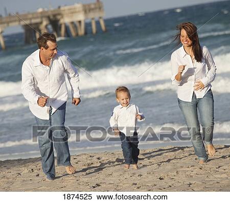 fort lauderdale, florida, united states of america; a family walking on the beach along the ocean View Large Photo Image Stock Photography - fort lauderdale, florida, united states of america; a family walking on the beach along the ocean. Fotosearch
