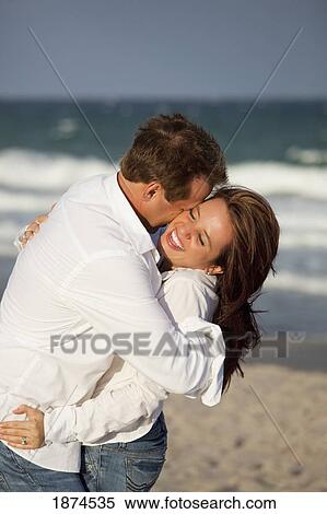 fort lauderdale, florida, united states of america; a couple in an embrace on the beach View Large Photo Image Stock Photography - fort lauderdale, florida, united states of america; a couple in an embrace on the beach. Fotosearch