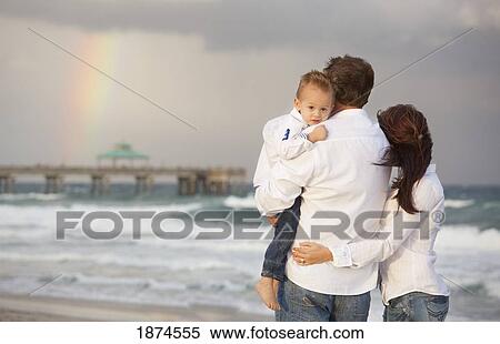 fort lauderdale, florida, united states of america; a family on the beach looking at a rainbow in the sky View Large Photo Image Stock Photography - fort lauderdale, florida, united states of america; a family on the beach looking at a rainbow in the sky. Fotosearch