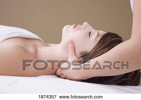 getting a neck massage from a massage therapist View Large Photo Image Stock Photo - getting a neck massage from a massage therapist. Fotosearch