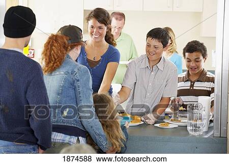 Group of people at community buffet View Large Photo Image Stock Photo - Group of people at community buffet. Fotosearch