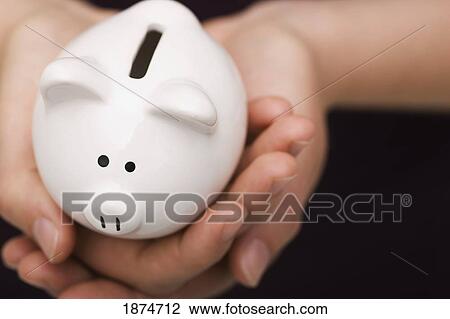 hands holding a piggy bank View Large Photo Image Stock Image - hands holding a piggy bank. Fotosearch