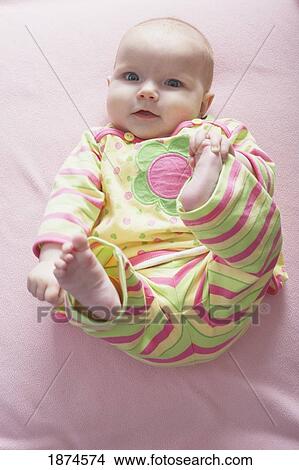 knoxville, tennessee, united states of america; a baby girl laying on her back View Large Photo Image Picture - knoxville, tennessee, united states of america; a baby girl laying on her back. Fotosearch