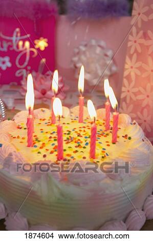 knoxville, tennessee, united states of america; candles lit on a birthday cake View Large Photo Image Picture - knoxville, tennessee, united states of america; candles lit on a birthday cake. Fotosearch