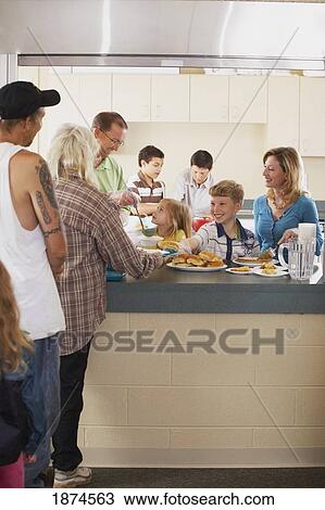 knoxville, tennessee, united states of america; a family serving a meal to those in need View Large Photo Image Stock Image - knoxville, tennessee, united states of america; a family serving a meal to those in need. Fotosearch