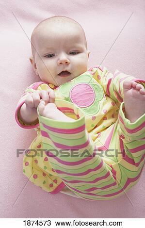 knoxville, tennessee, united states of america; a baby girl playing with her toes View Large Photo Image Stock Image - knoxville, tennessee, united states of america; a baby girl playing with her toes. Fotosearch
