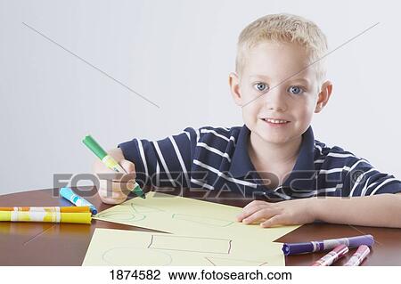 knoxville, tennessee, united states of america; a boy coloring at a table View Large Photo Image Stock Image - knoxville, tennessee, united states of america; a boy coloring at a table. Fotosearch