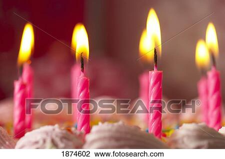 knoxville, tennessee, united states of america; candles lit on a birthday cake View Large Photo Image Stock Image - knoxville, tennessee, united states of america; candles lit on a birthday cake. Fotosearch